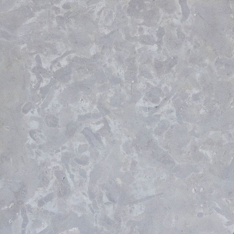 Color/Finish variation image for Midwest Gray Limestone - Vein Cut. The surface finish shown is honed. Dominant colors shown are blue and gray; with tan and cream secondaries. The color mix creates a warm feeling. Random color pattern.