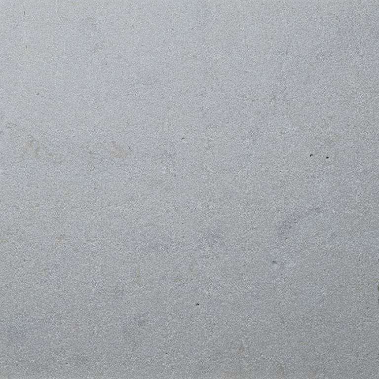 Color/Finish variation image for Gray Limestone. The surface finish shown is sand blasted. The dominant color shown is gray. The color mix creates a cool feeling.