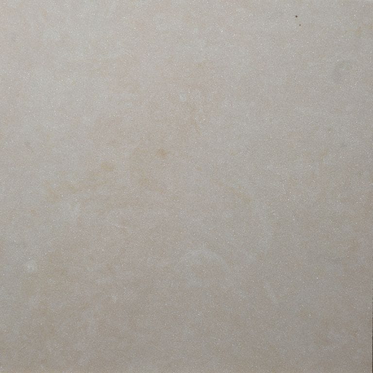 Color/Finish variation image for Buff Limestone. The surface finish shown is honed. Dominant colors shown are gray and tan. The color mix creates a warm feeling.