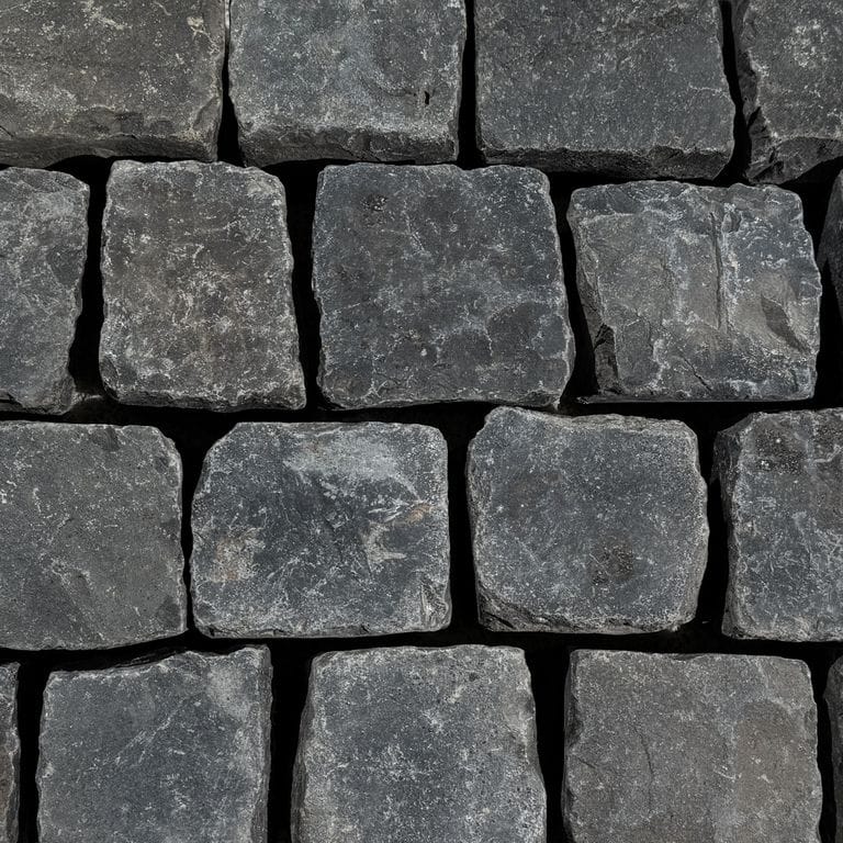 Color/Finish variation image for Reclaimed Basalt Cobblestones. The surface finish shown is . The dominant color shown is black. The color mix creates a cool feeling.