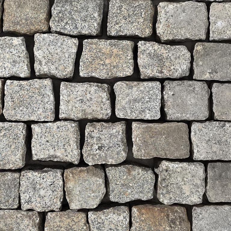 Color/Finish variation image for Reclaimed Berlin Granite Cobblestones. The surface finish shown is . Dominant colors shown are gray and white.
