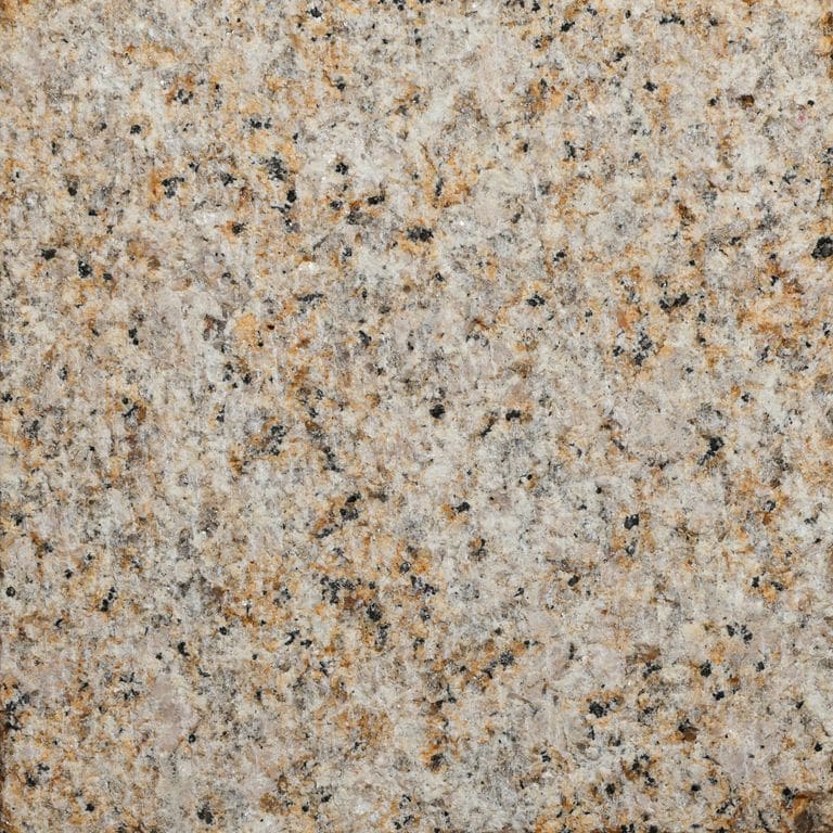 Color/Finish variation image for Amber Granite. The surface finish shown is adze. Dominant colors shown are yellow and tan. The color mix creates a warm feeling.