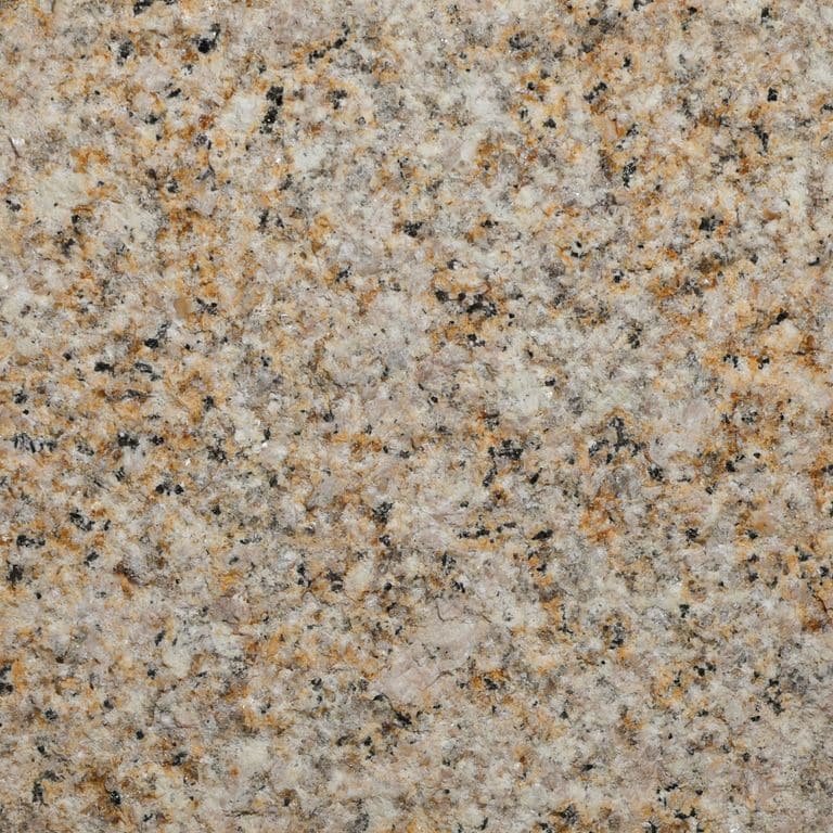Color/Finish variation image for Amber Granite. The surface finish shown is bush hammered. Dominant colors shown are brown, yellow and tan. The color mix creates a warm feeling. Coarse speckled color pattern.