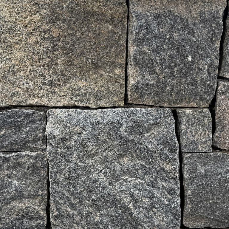 Color/Finish variation image for Hoth Hill Granite. The surface finish shown is split-face. The dominant color shown is gray. The color mix creates a warm feeling.