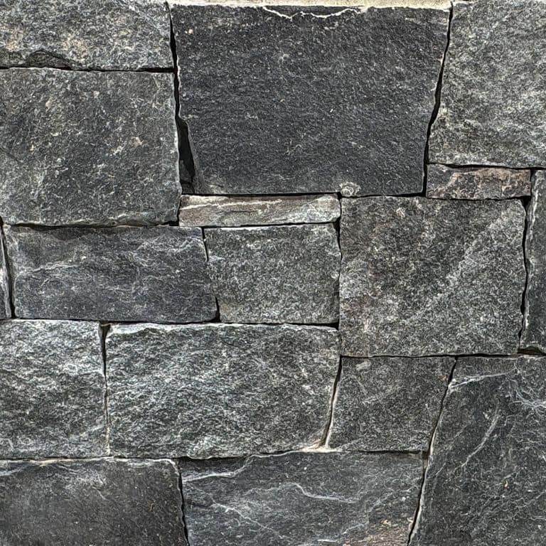 Color/Finish variation image for Green Mountain Granite. The surface finish shown is split-face. The dominant color shown is gray. Speckled and coarse speckled color patterns.