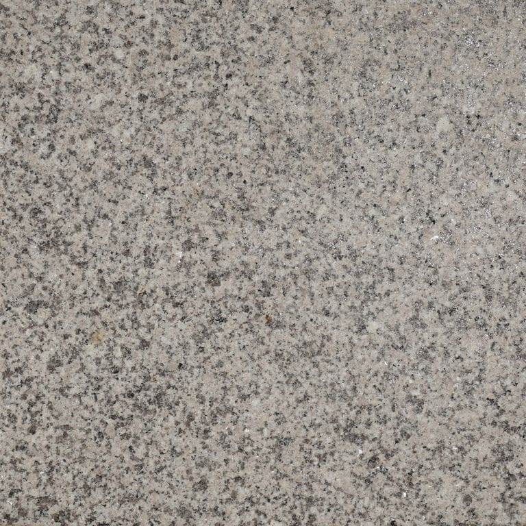 Swatch image for Amber Light Granite. The surface finish shown is flamed. The dominant color shown is gray. The color mix creates a warm feeling.