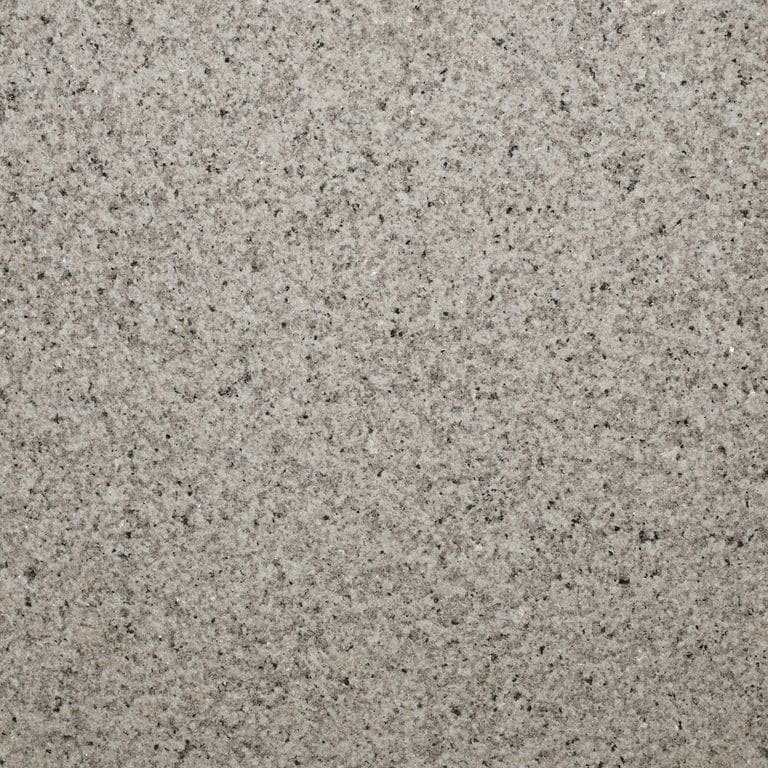 Color/Finish variation image for Amber Light Granite. The surface finish shown is sand blasted. The dominant color shown is gray.