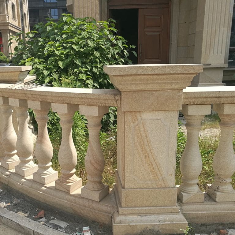 Application image for Beige Vein Cut Granite. The image shows this material being used for architectural elements and columns. Dominant colors shown are orange/rust and tan. The color mix creates a warm feeling.