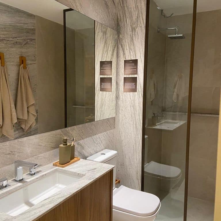 Application image for Strata Snow Gneiss. The image shows this material being used in an interior cladding application. The surface finish shown is polished. The dominant color shown is white. The color mix creates a warm feeling.