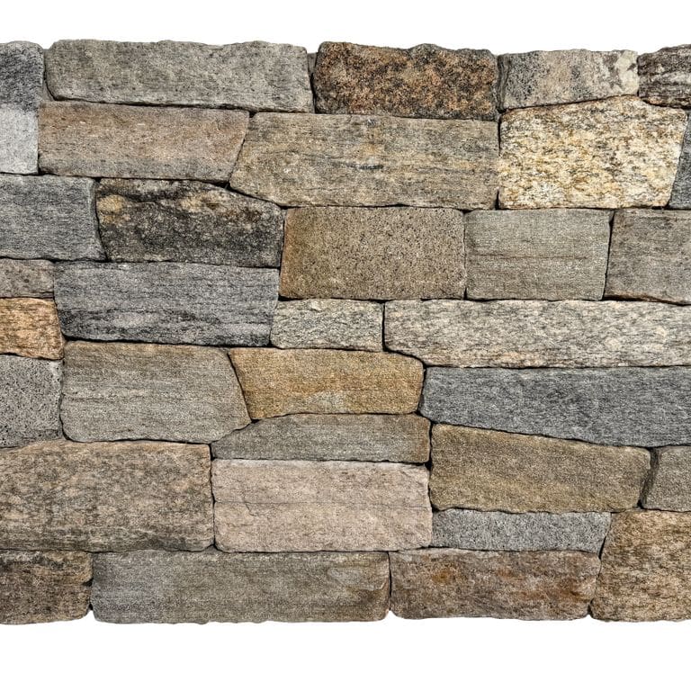 Application image for Boston Blend Granite. The image shows this material being used in a thin veneer application. The surface finish shown is split-face. Dominant colors shown are brown, gray and tan. The color mix creates a warm feeling.