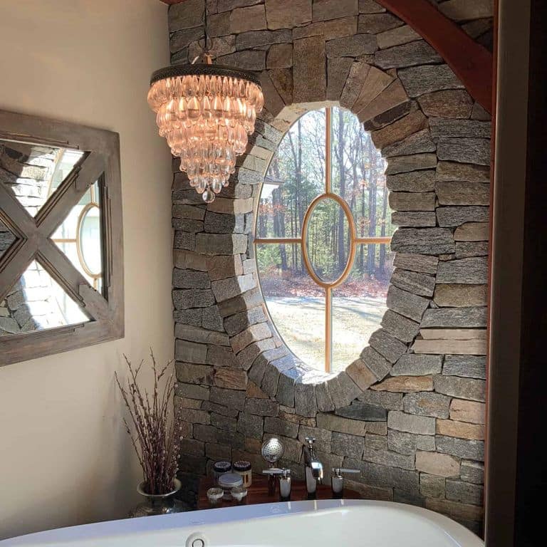 Application image for Boston Blend Granite. The image shows this material being used in a thin veneer application. The surface finish shown is split-face. The dominant color shown is gray. The color mix creates a cool feeling.