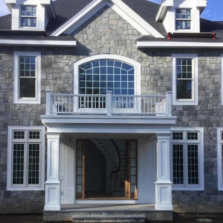 Application image for Oyster Bay Granite. The image shows this material being used in a thin veneer application. The surface finish shown is . The dominant color shown is gray. The color mix creates a cool feeling.