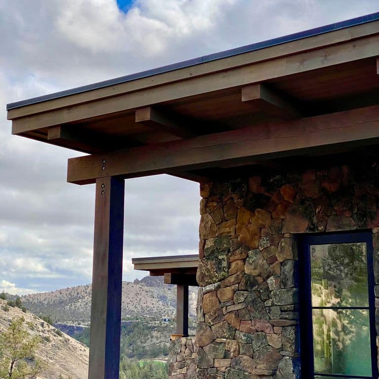 Application image for Montana Moss Rock. The image shows this material being used in a full bed veneer application. The dominant color shown is brown. The color mix creates a warm feeling.