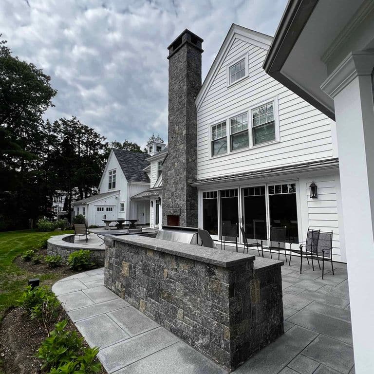 Application image for Vineyard Granite. The image shows this material being used in a thin veneer application. The surface finish shown is . The dominant color shown is gray. The color mix creates a warm feeling.