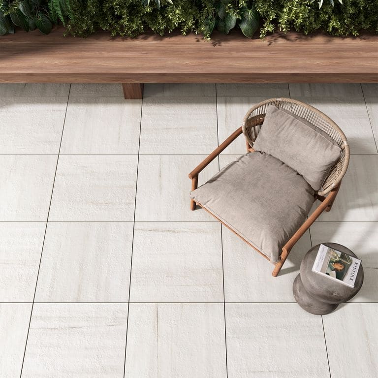 Feature image for Beyond Dolomite Warm White. The image shows this material being used in a patio pavers application. The surface finish shown is . The dominant color shown is white. The color mix creates a warm feeling.