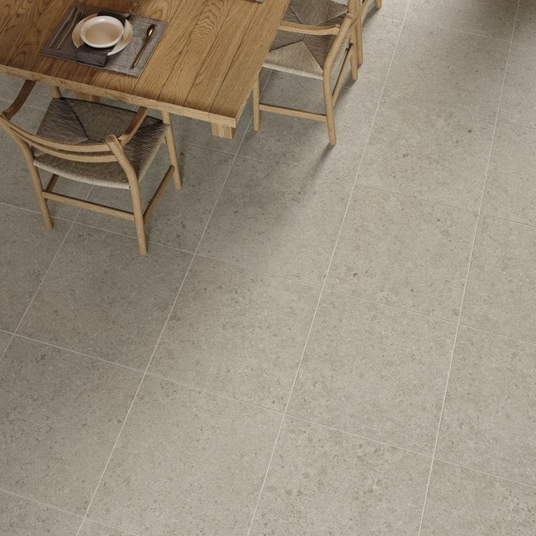 Feature image for Legacy Limestone Silver. The image shows this material being used in a patio pavers application. The surface finish shown is . Dominant colors shown are brown, gray and tan.