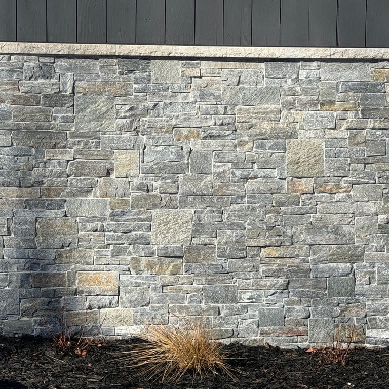 Application image for Charcoal Oakley Stone. The image shows this material being used in a thin veneer application. The dominant color shown is gray. The color mix creates a cool feeling.