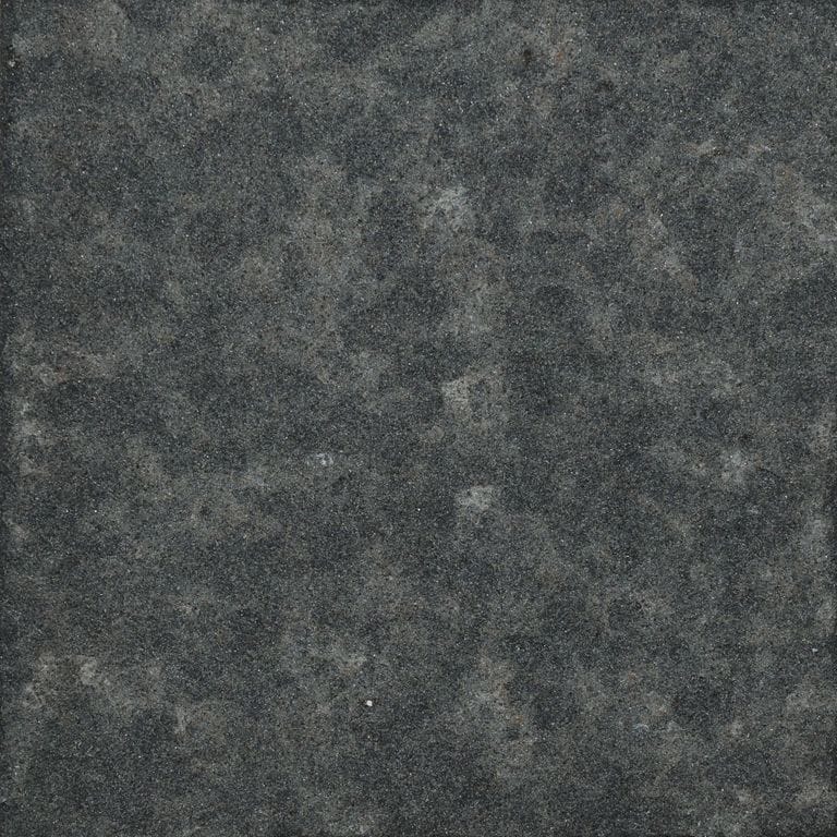 Color/Finish variation image for Mongolian Black Basalt. The surface finish shown is flamed. Dominant colors shown are black and gray. The color mix creates a cool feeling.