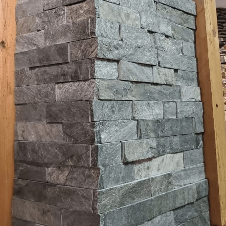 Application image for Cowboy Coffee Quartzite. The image shows this material being used in a thin veneer application. The dominant color shown is gray. The color mix creates a cool feeling.