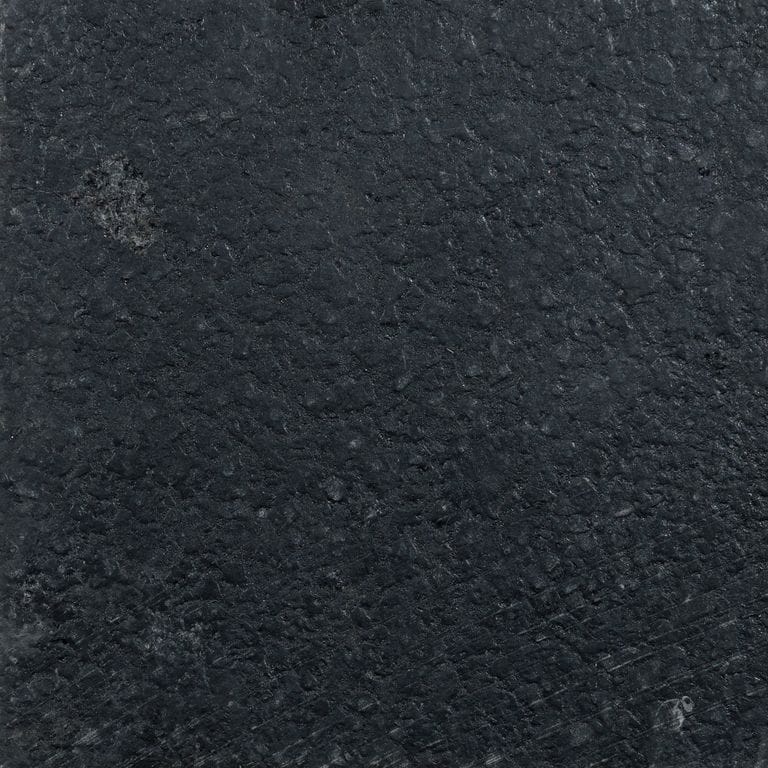 Color/Finish variation image for Waltin Black Limestone. The surface finish shown is acid washed. The dominant color shown is black. The color mix creates a cool feeling.