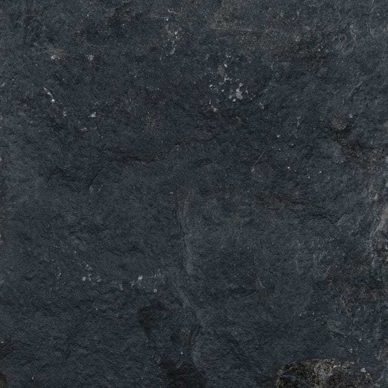 Color/Finish variation image for Waltin Black Limestone. The surface finish shown is split-face. The dominant color shown is black. The color mix creates a cool feeling.