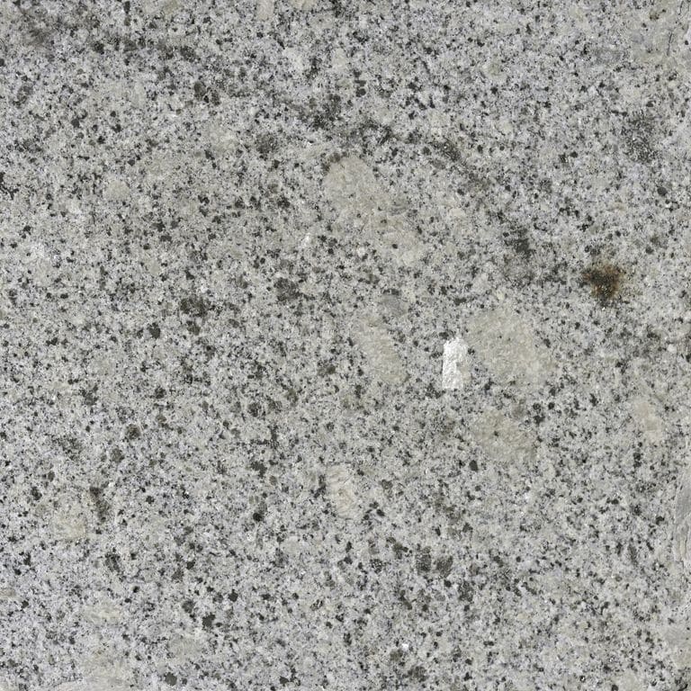 Color/Finish variation image for Oak Mountain Granite. The surface finish shown is flamed. The dominant color shown is gray; with beige, green and white secondaries. Exhibits "movement" and the color mix creates a cool feeling. Speckled, blotched and cloudy color patterns.