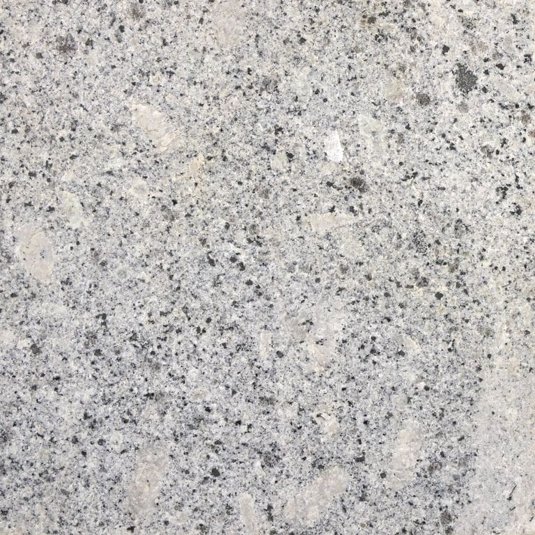 Color/Finish variation image for Oak Mountain Granite. The surface finish shown is flamed. The dominant color shown is gray; with beige, pink, white and cream secondaries. Exhibits "movement" and the color mix creates a cool feeling. Coarse speckled and blotched color patterns.