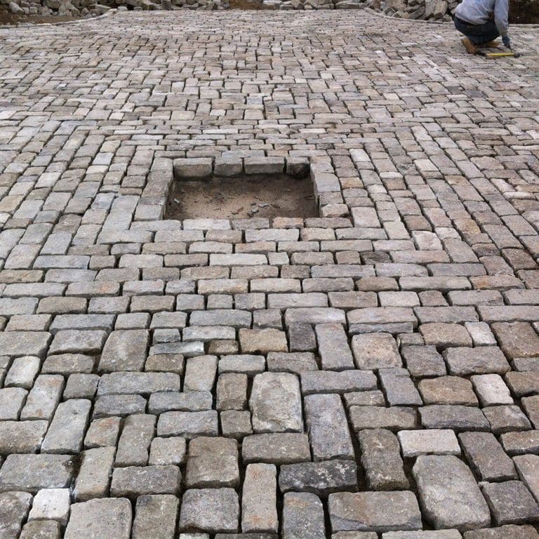 The image shows this material being used for driveway pavers and patio pavers.