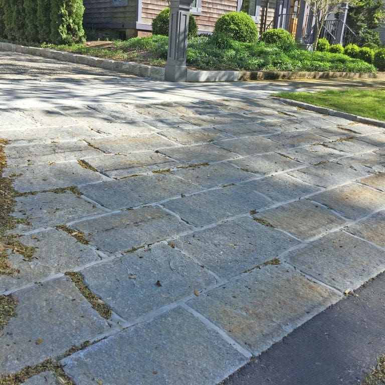 The image shows this material being used for driveway pavers and driveway aprons.