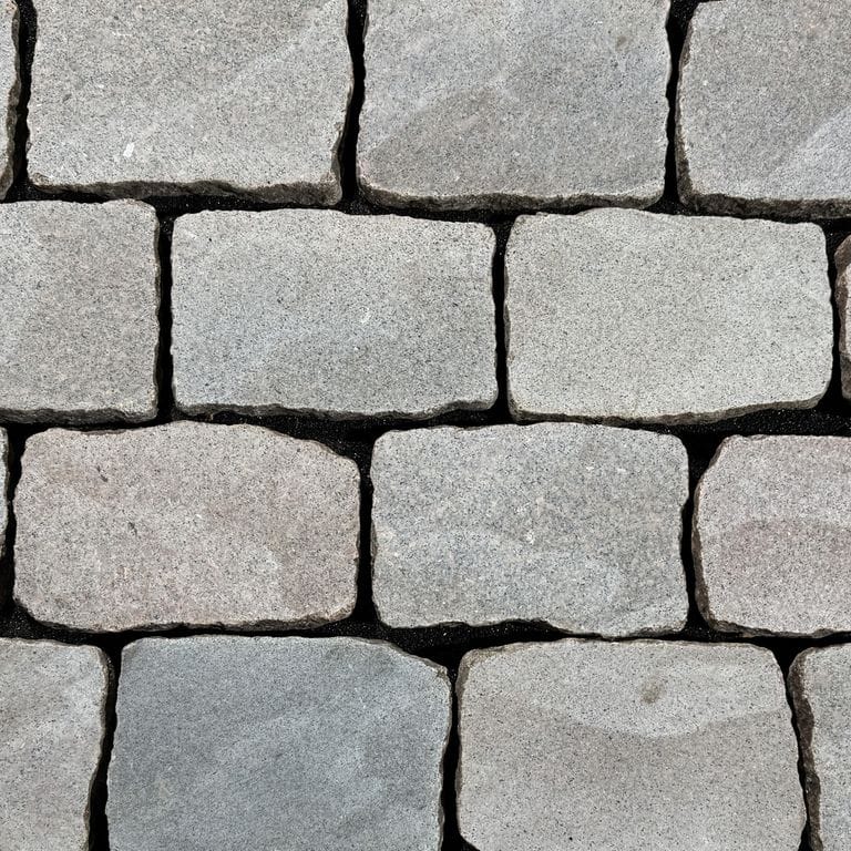 Color/Finish variation image for Reclaimed Swedish Granite Cobblestones. The surface finish shown is sawn. The dominant color shown is gray. The color mix creates a cool feeling.