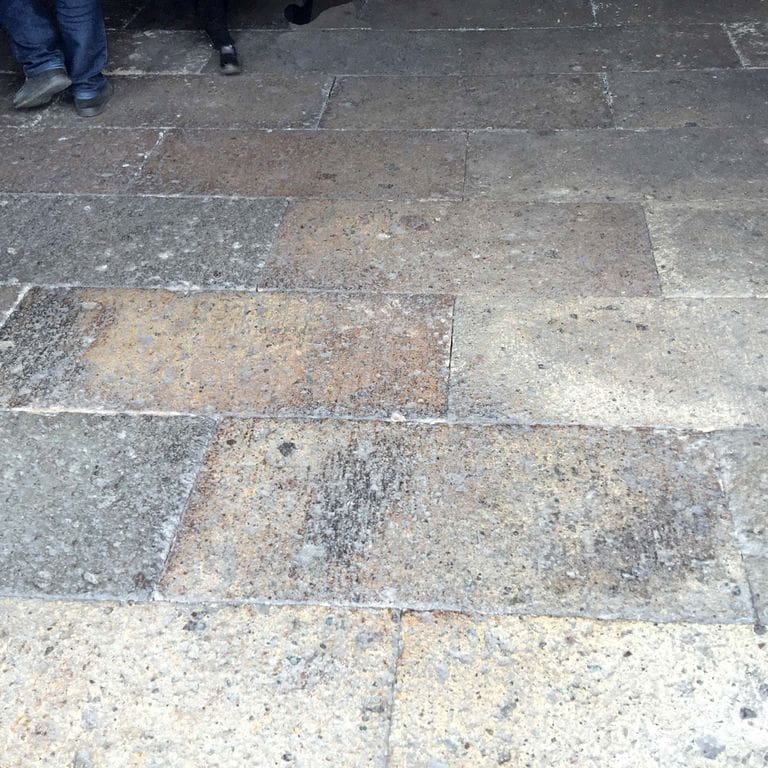 Application image for Porphyry - Reclaimed Plank Pavers. The image shows this material being used for path pavers and patio pavers. The dominant color shown is gray. The color mix creates a cool feeling.