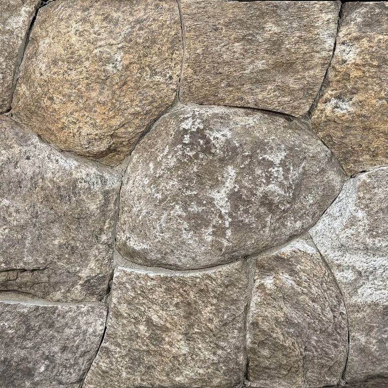 Color/Finish variation image for New England Fieldstone Rounds. The surface finish shown is weathered. Dominant colors shown are gray and tan. The color mix creates a warm feeling.
