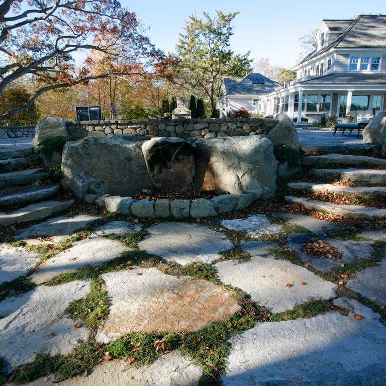 The image shows this material being used in a patio pavers application.