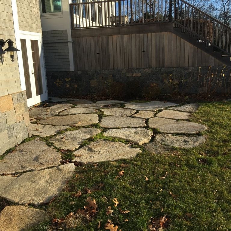 The image shows this material being used in a patio pavers application. Dominant colors shown are beige and brown; with a tan secondary. The color mix creates a warm feeling. Regular and random color patterns.