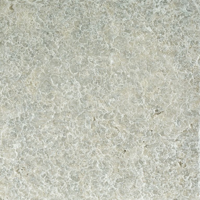 Color/Finish variation image for Limestone - Mountain Hard Blue. The surface finish shown is . Dominant colors shown are beige and gray; with green, white and cream secondaries. Exhibits "movement" and the color mix creates a warm feeling. Regular and coarse speckled color patterns.