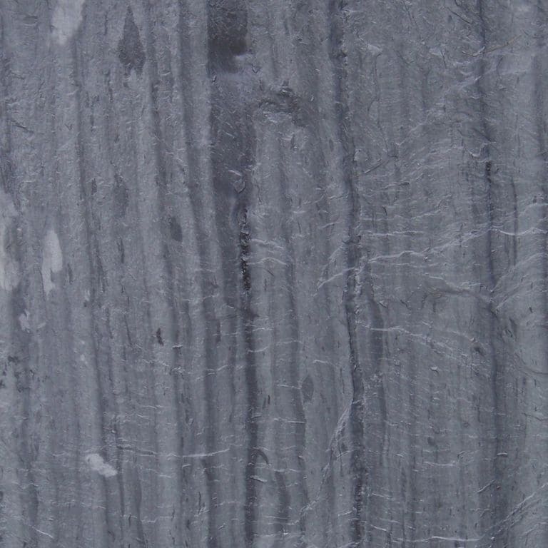 Swatch image for Slate - Vermont - Striated Gray. The surface finish shown is natural cleft. Dominant colors shown are blue and gray; with green and purple secondaries. Exhibits "movement" and the color mix creates a cool feeling. Streaked color pattern.