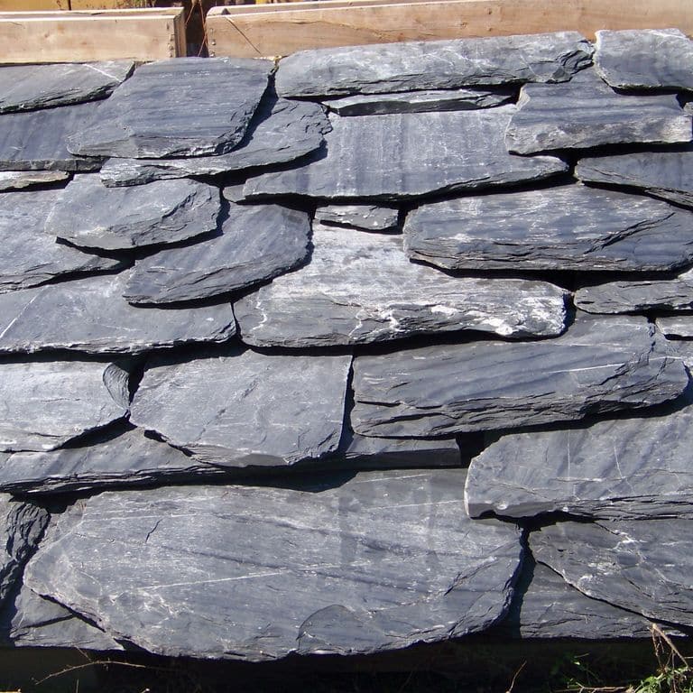 Application image for Slate - Vermont Slate - Striated Gray. The image shows this material being used in a Roof Shingles application. This is a building and landscape stone for indoor and outdoor commercial and residential applications. Suitable for general use, freeze-thaw conditions, high traffic areas and high heel compatibilty situations. Moderate to higher on the price spectrum.