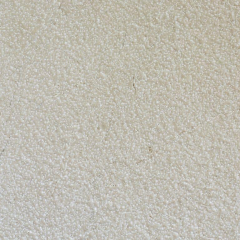 Color/Finish variation image for Mountain Hard Limestone - Beige. The surface finishes shown are brushed and fine bush hammered. Dominant colors shown are beige, gray and white; with a tan secondary. The color mix creates a warm feeling. Speckled color pattern.