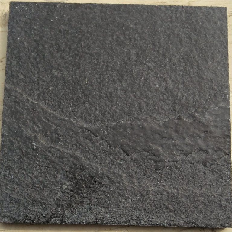 Color/Finish variation image for Limestone - Bahama Black. The surface finish shown is brushed. Dominant colors shown are black and gray. Exhibits "movement" and the color mix creates a warm feeling. Regular and speckled color patterns.