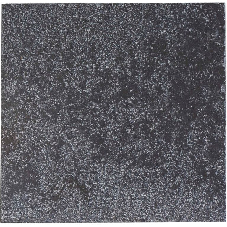 Color/Finish variation image for Limestone - Bahama Black. The surface finish shown is bush hammered. Dominant colors shown are black and gray; with a purple secondary. The color mix creates a cool feeling. Speckled and blotched color patterns.