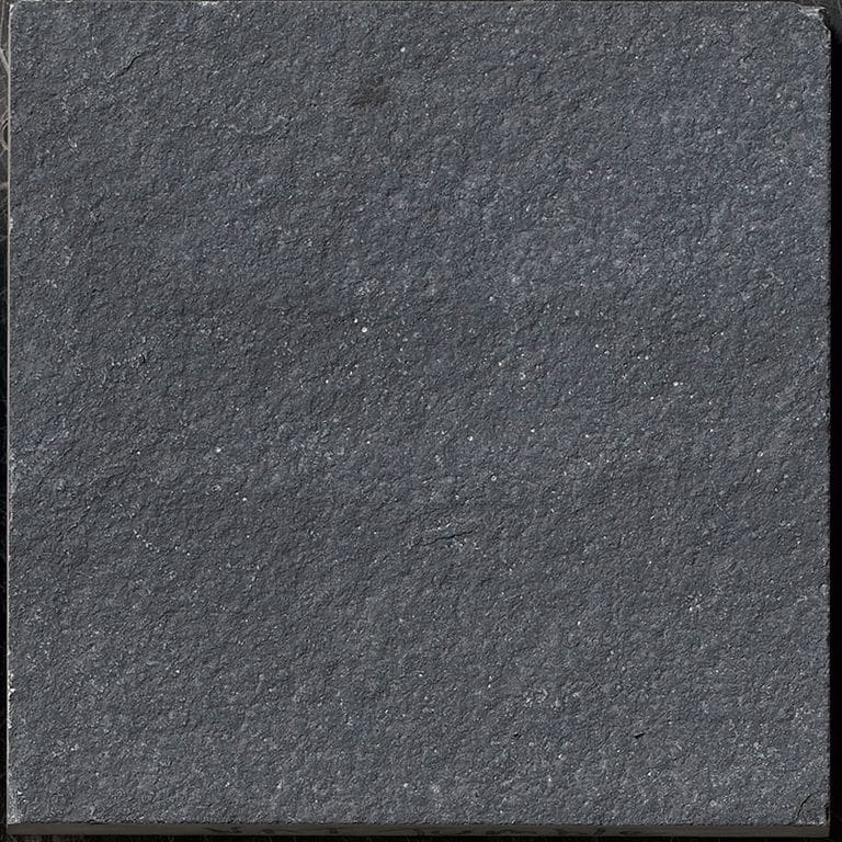 Color/Finish variation image for Limestone - Bahama Black. The surface finish shown is tumbled. The dominant color shown is gray; with black, brown and green secondaries. The color mix creates a cool feeling. Solid and fine speckled color patterns.