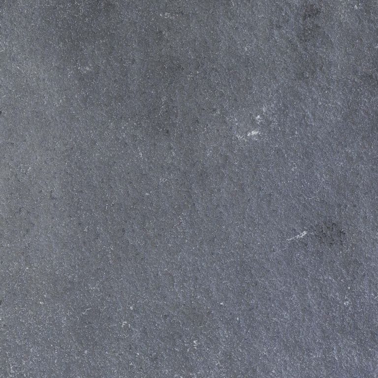 Color/Finish variation image for Bahama Black Limestone. The surface finish shown is tumbled. The dominant color shown is gray; with blue, brown, green and purple secondaries. The color mix creates a cool feeling. Solid, speckled, blotched and cloudy color patterns.
