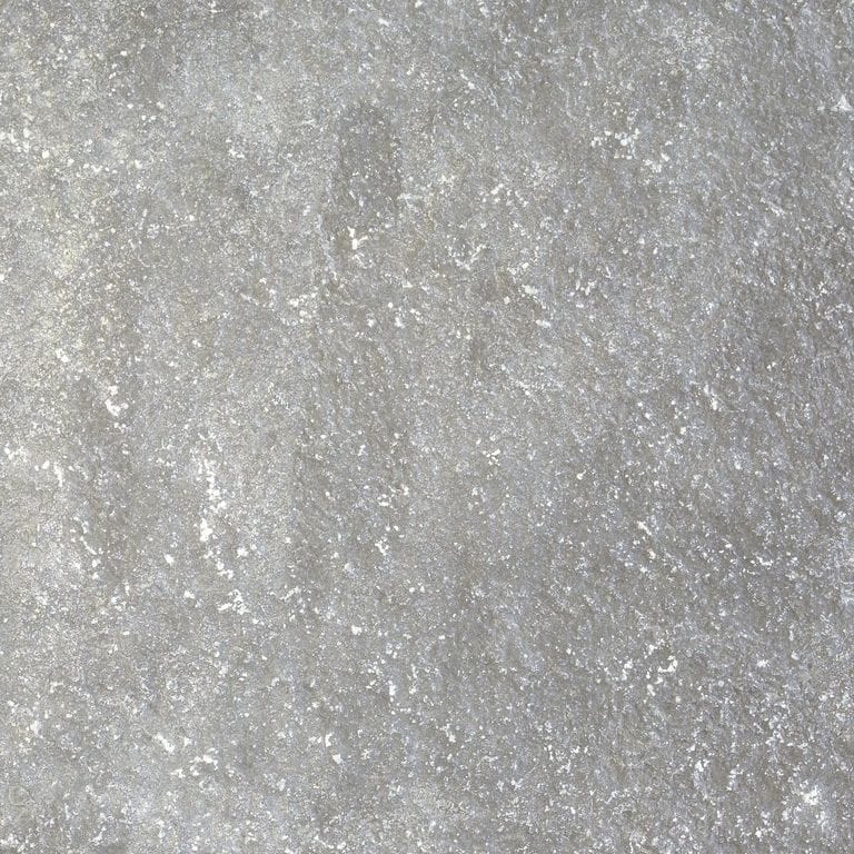 Feature image for Riviera Limestone. The dominant color shown is gray; with beige, blue, purple and white secondaries. The color mix creates a cool feeling. Solid, speckled and blotched color patterns.
