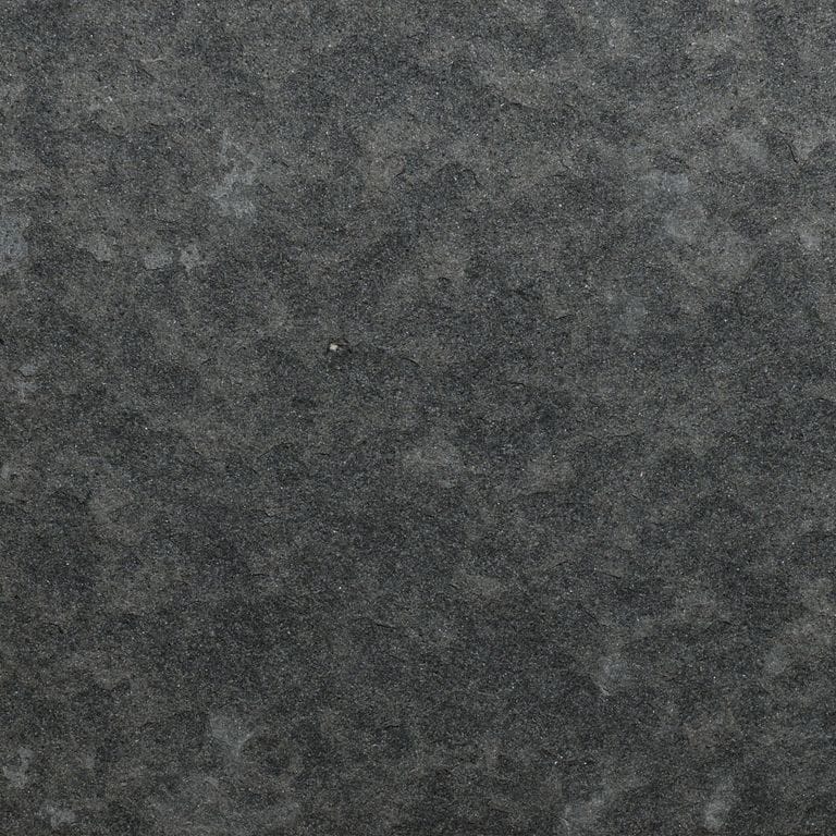 Swatch image for Nordic Black Basalt. The surface finish shown is flamed. The dominant color shown is gray. The color mix creates a cool feeling.