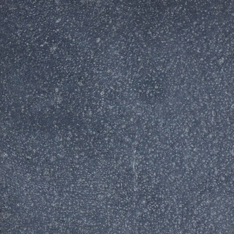 Color/Finish variation image for Nordic Black Basalt. The surface finish shown is leathered. Dominant colors shown are green and gray; with brown and purple secondaries. Solid and fine speckled color patterns.