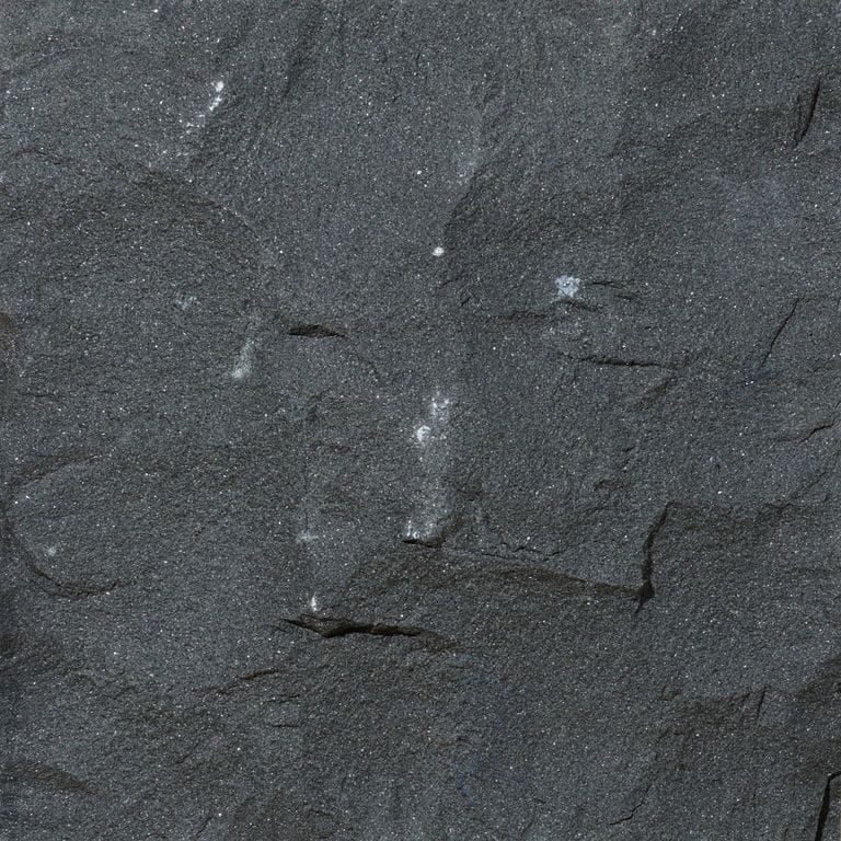 Color/Finish variation image for Basalt - Nordic Black. The surface finish shown is split-face. The dominant color shown is black. The color mix creates a cool feeling.