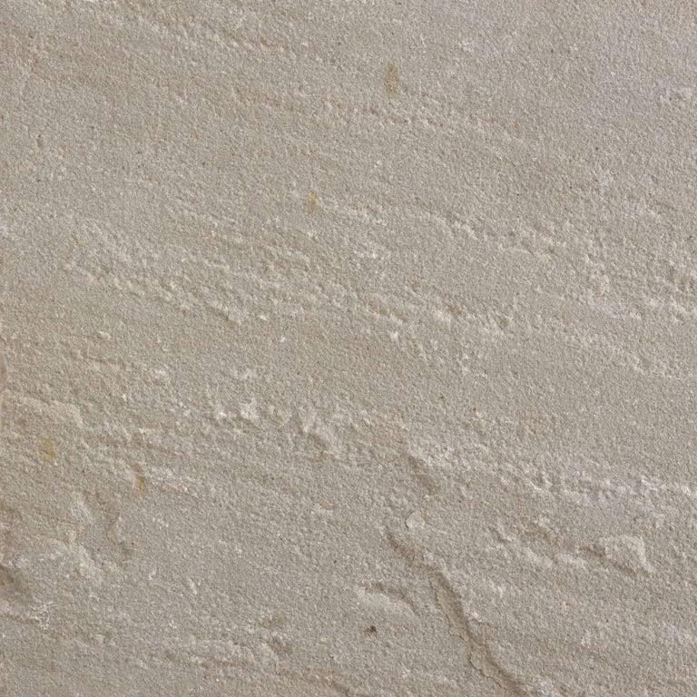 Swatch image for Sandstone - Asheville. The surface finish shown is a combination of honed and natural cleft. Dominant colors shown are beige and gray; with brown, purple and tan secondaries. Exhibits "movement" and the color mix creates a warm feeling. Linear color pattern.