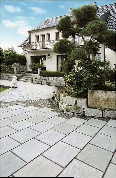 The image shows this material being used in a path pavers application.