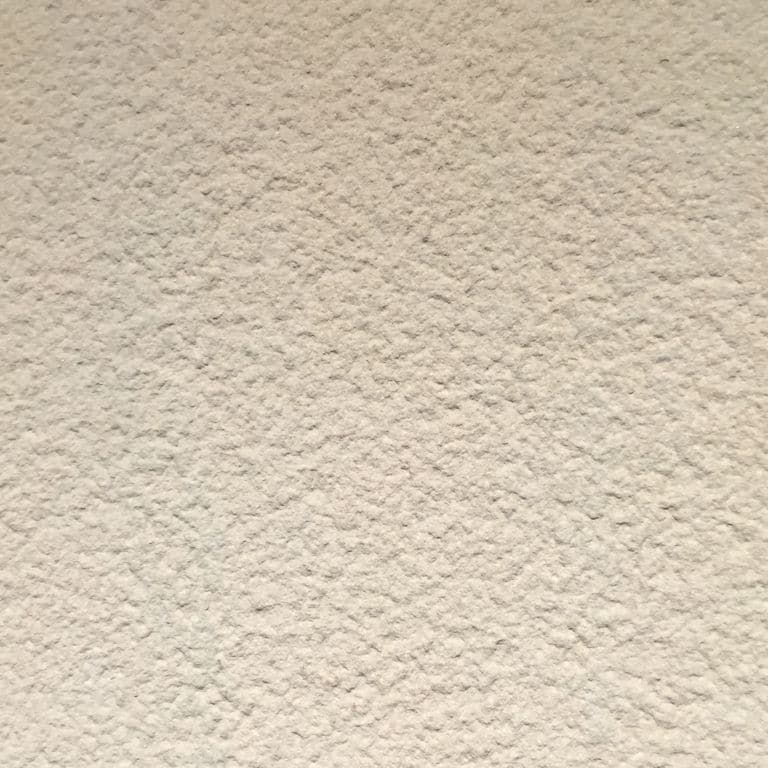 Color/Finish variation image for Portland Beige Sandstone. The surface finish shown is bush hammered. Dominant colors shown are beige and tan; with pink and cream secondaries. The color mix creates a warm feeling. Speckled color pattern.