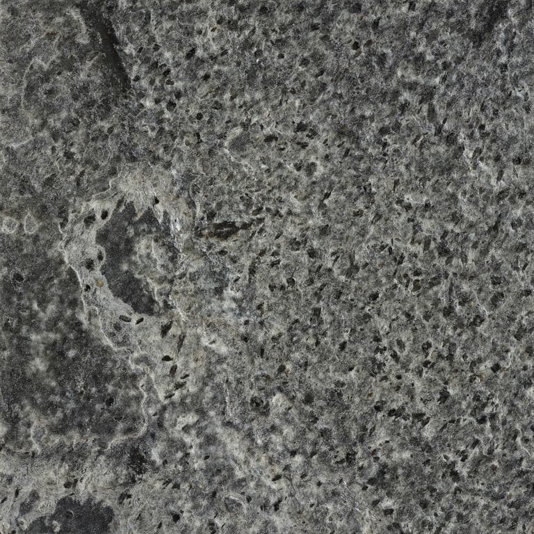 Color/Finish variation image for Quartzite - Amazon. The surface finish shown is brushed. Dominant colors shown are green and gray; with black and brown secondaries. Exhibits "movement" and the color mix creates a cool feeling. Swirled, blotched, random and coarse speckled color patterns.